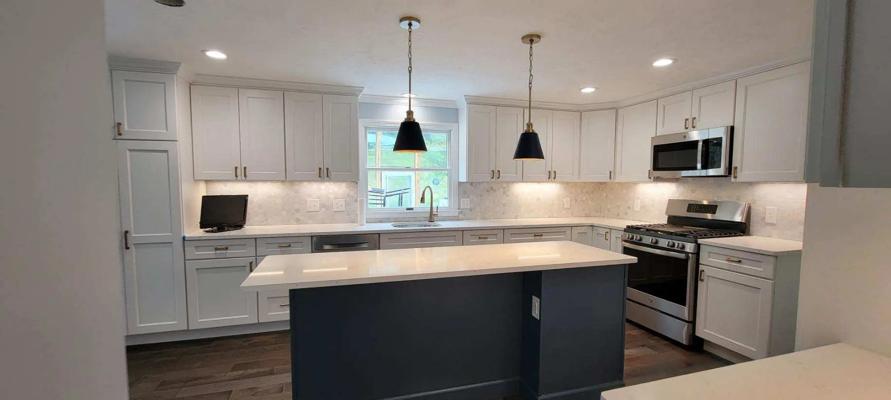 Kitchen with ship lap ceiling and large counter space